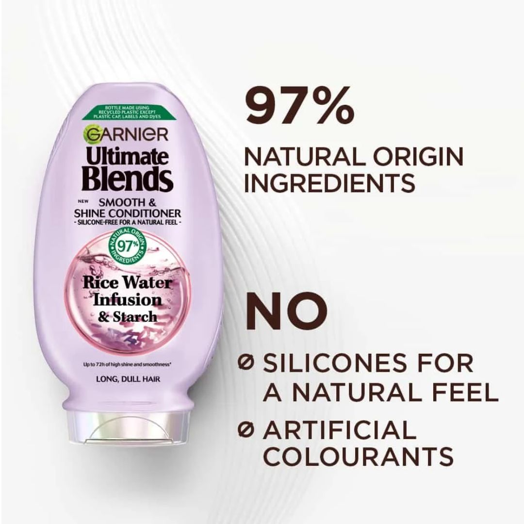 Garnier Ultimate Blends Rice Water Infusion & Starch Smooth & Shine Conditioner bottle on a white background with promotional text highlighting natural ingredients and no silicones or artificial colourants.