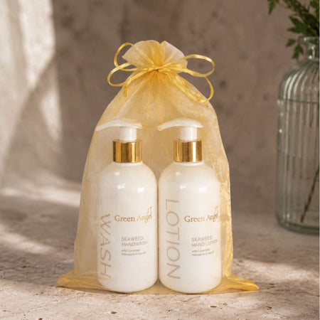 Green Angel Love Your Hands Giftset on a marble countertop with a marble background