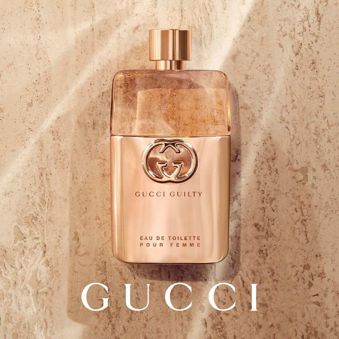 Gucci Guilty Pour Femme Eau de Toilette 50ml on a marble background