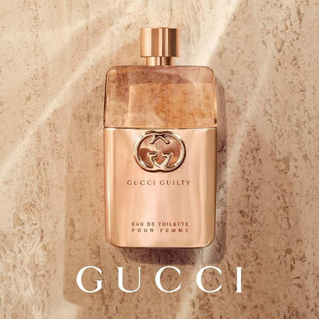 Gucci Guilty Pour Femme Eau de Toilette 50ml on a marble background