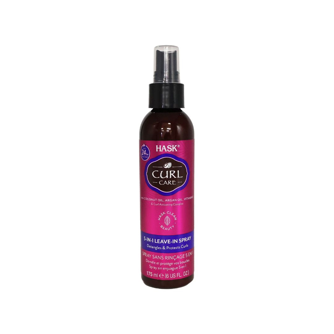 A bottle of Hask Curl Care 5-in-1 Leave-In Spray on a plain white background. The bottle is dark amber brown with a black spray nozzle and a vibrant magenta-pink label featuring the Hask brand logo.