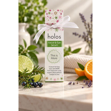 Holos Facial & Eye Serum Cracker on a marble counter top