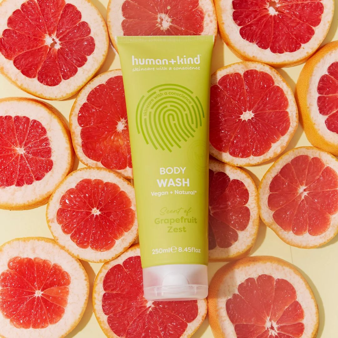 Human+Kind Grapefruit Zest Body Wash 250ml on a grapefruit background
