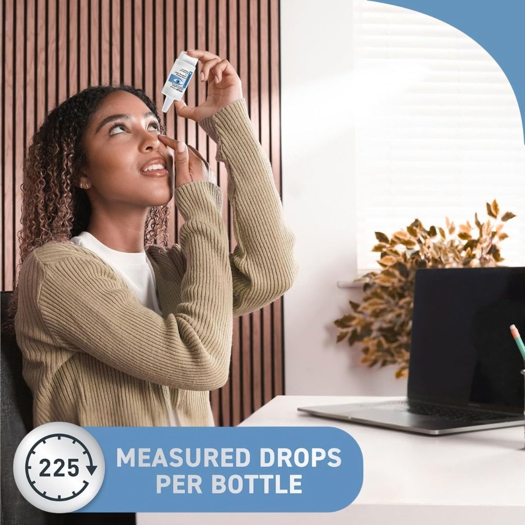 A woman in a beige ribbed sweater holds a small dropper bottle above her nose in a home office setting. A blue banner at the bottom reads '225 MEASURED DROPS PER BOTTLE' with a clock icon.