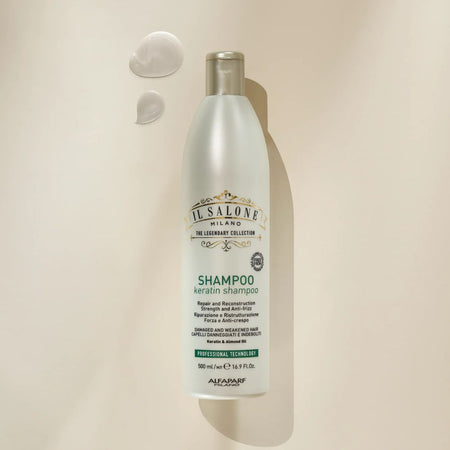 A 500ml bottle of IL SALONE Milano The Legendary Collection Shampoo Keratin Shampoo, displayed on a warm beige background with two dollops of white cream above it.