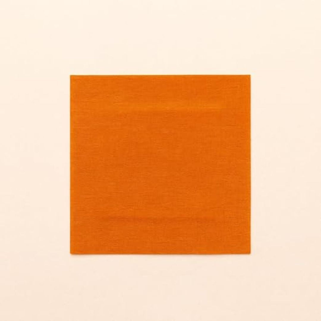 A square orange fabric swatch with a subtle woven texture, centered on a solid off-white background.