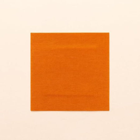 A square orange fabric swatch with a subtle woven texture, centered on a solid off-white background.