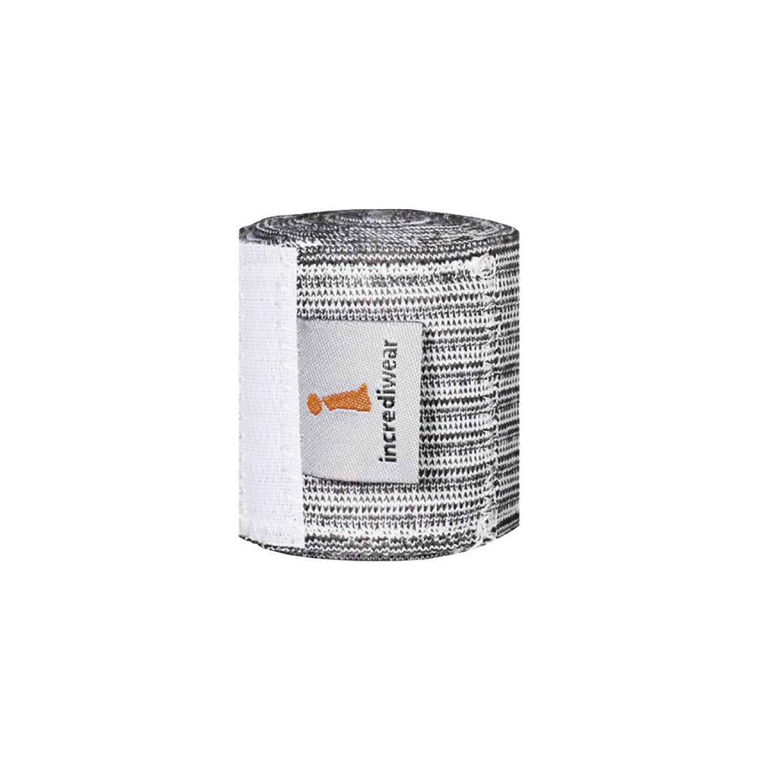 A roll of black and white patterned athletic tape with a white label that reads 'incredivear' and features an orange logo, set against a plain white background.
