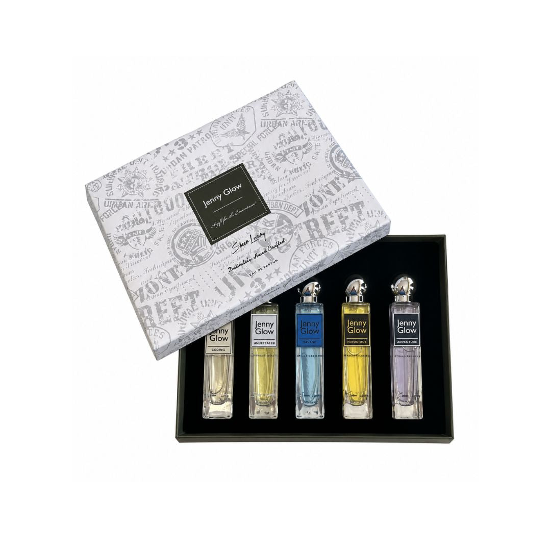 A boxed fragrance gift set on a white background, featuring a white patterned outer box with a black label reading 'Jenny Glow' and a black tray holding four small spray bottles with different colored liquids.