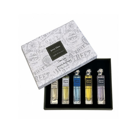 A boxed fragrance gift set on a white background, featuring a white patterned outer box with a black label reading 'Jenny Glow' and a black tray holding four small spray bottles with different colored liquids.