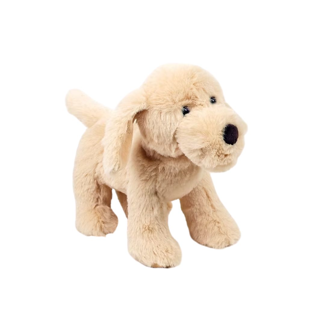 A plush toy dog in a light cream or golden-beige color, standing on a solid white background.