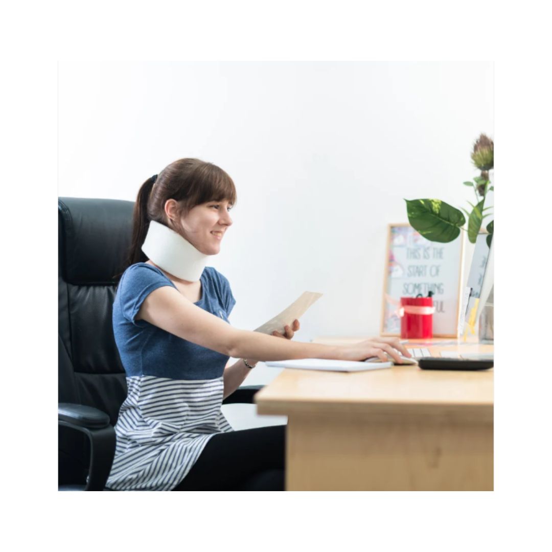 Kedley soft neck collar on woman seated at a desk