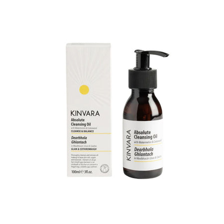 Kinvara Absolute Cleansing Oil 100ml bottle with a black pump next to its white packaging box on a plain white background.