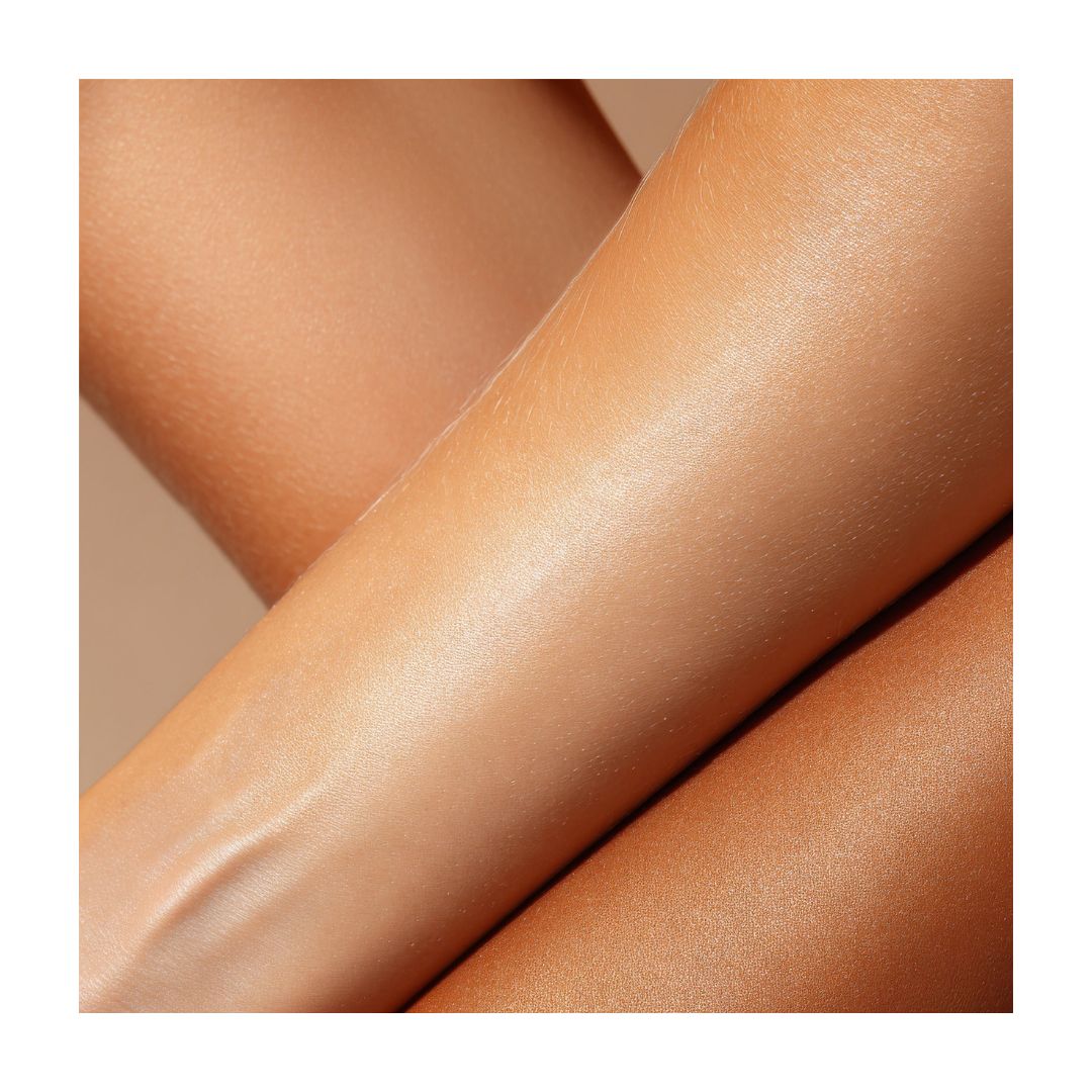 Lisa & Co. Gradual Tan Moisturiser Light/Medium on a models wrist