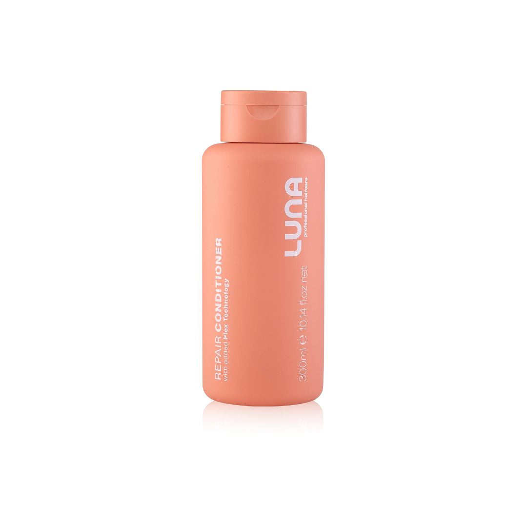 A 200ml bottle of LUNA Repair Conditioner in a soft peach-orange color, shown on a clean white background with a subtle reflection.