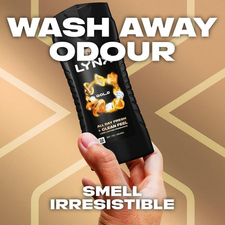 Hand holding a black bottle labeled 'LYRA Gold' with text 'Wash Away Odour' and 'Smell Irresistible' on a gold geometric pattern background.