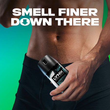 Person holding a Lynx deodorant stick with text 'Smell Finer Down There' on a green background