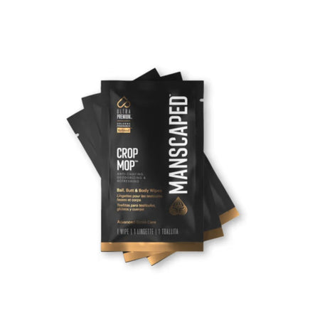 A stack of black Manscaped Crop Mop hair removal wipes with gold accents and white text, shown on a plain white background.