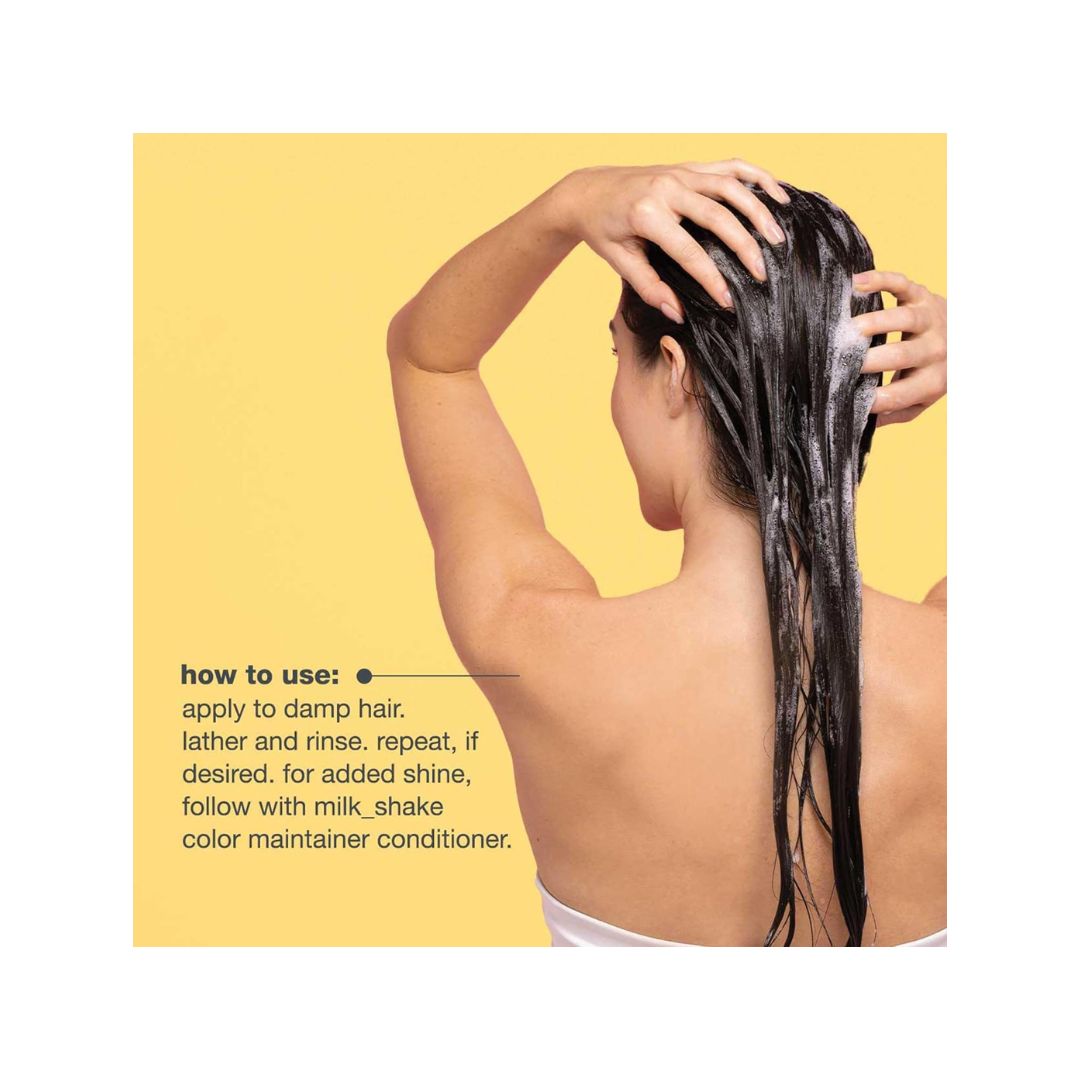 milk_shake Colour Maintainer Shampoo usage information on a yellow background to the left of a woman washing her hair with the product