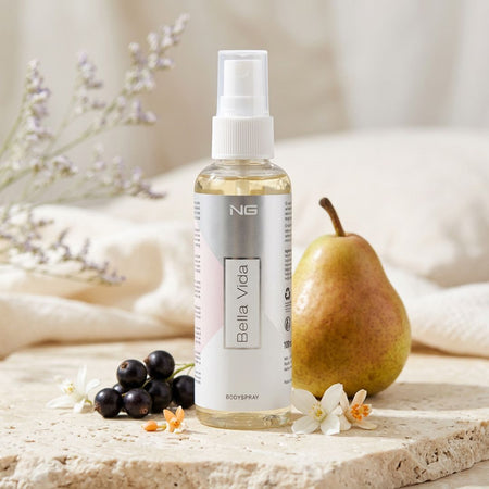 NG Bella Vida Body Spray 100ml on a marble background with pear and berries