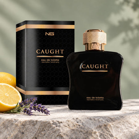 NG Fragrance Caught Eau de Toilette 100ml on a stone countertop with lemon and lavender