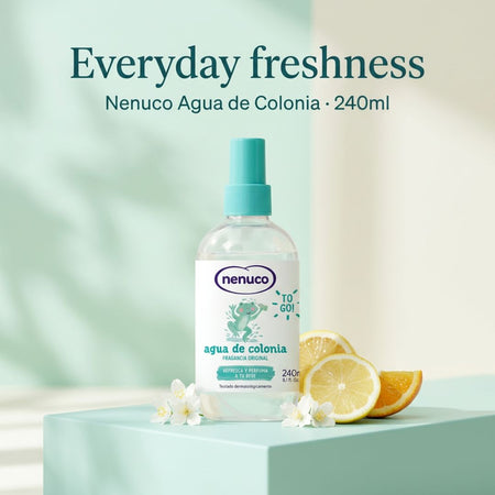 Nenuco Agua de Colonia 240ml on a white podium with lemon slices