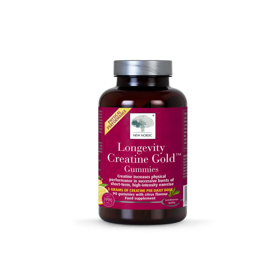 A bottle of New Nordic Longevity Creatine Gold Gummies on a clean white background. The product is in a dark amber brown bottle with a metallic silver cap and a deep magenta label featuring white and yellow text.