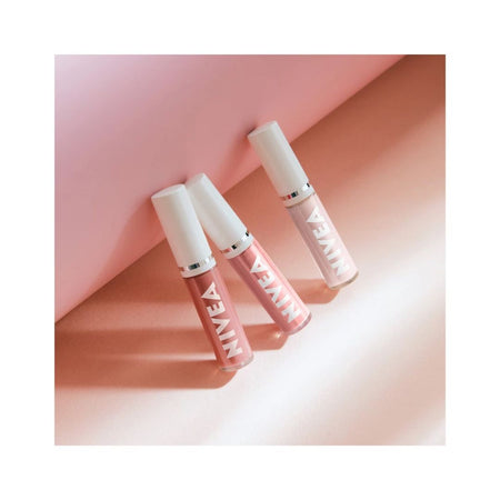 NIVEA Caring Lip Oil – Rose 5.5ml three lip oils on a pink background