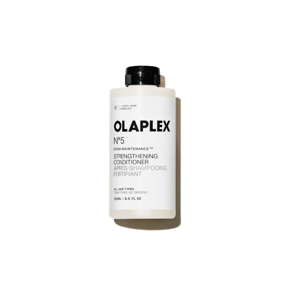 A white bottle of Olaplex No. 5 Bond Maintenance Strengthening Conditioner with a black cap, shown on a clean white background with a soft shadow.