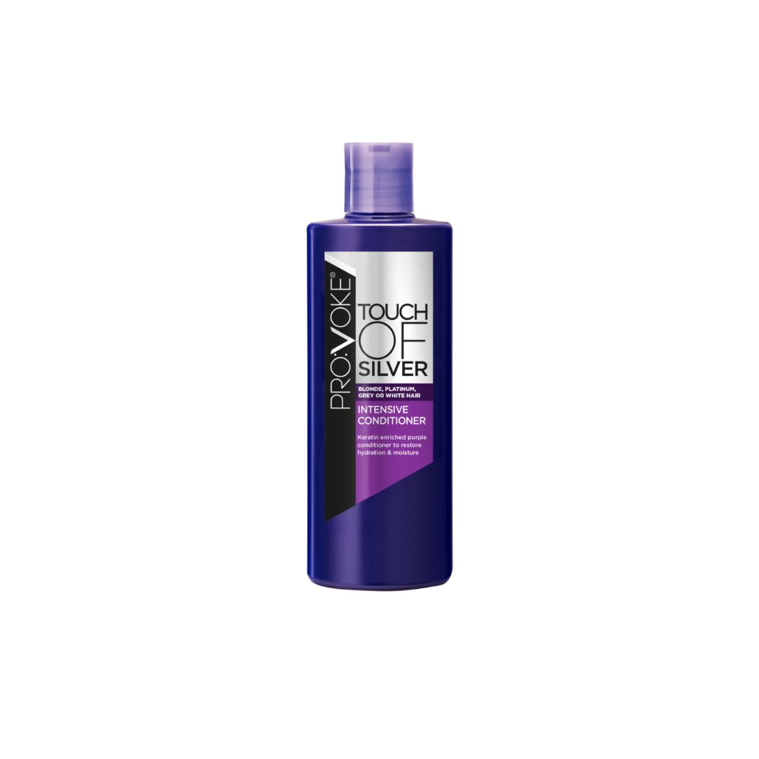 A bottle of Provoke Touch of Silver Intense Conditioner, featuring a deep purple bottle with a matching purple cap and a label that has silver, white, and black sections.