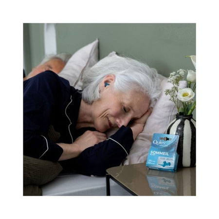 Quies Specific Sleep Ear Plugs on a night stand 