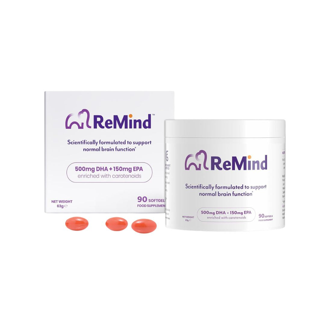 Two boxes of ReMind supplement with two orange capsules on a white background