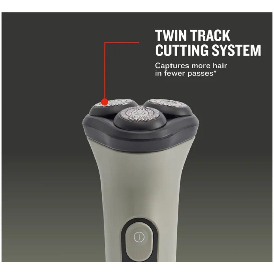 A close-up of an electric shaver handle with two visible cutting heads, shown on a dark gray background with overlaid text reading 'TWIN TRACK CUTTING SYSTEM' and a red pointer line indicating the cutting heads. Remington DuraCut Rotary Shaver 
