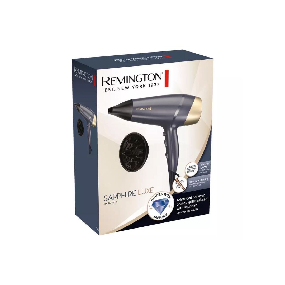 Remington Sapphire Luxe hair dryer packaging box, showing the dark gray and gold hair dryer and a black concentrator nozzle on a white and navy background.