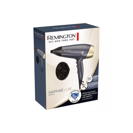 Remington Sapphire Luxe hair dryer packaging box, showing the dark gray and gold hair dryer and a black concentrator nozzle on a white and navy background.