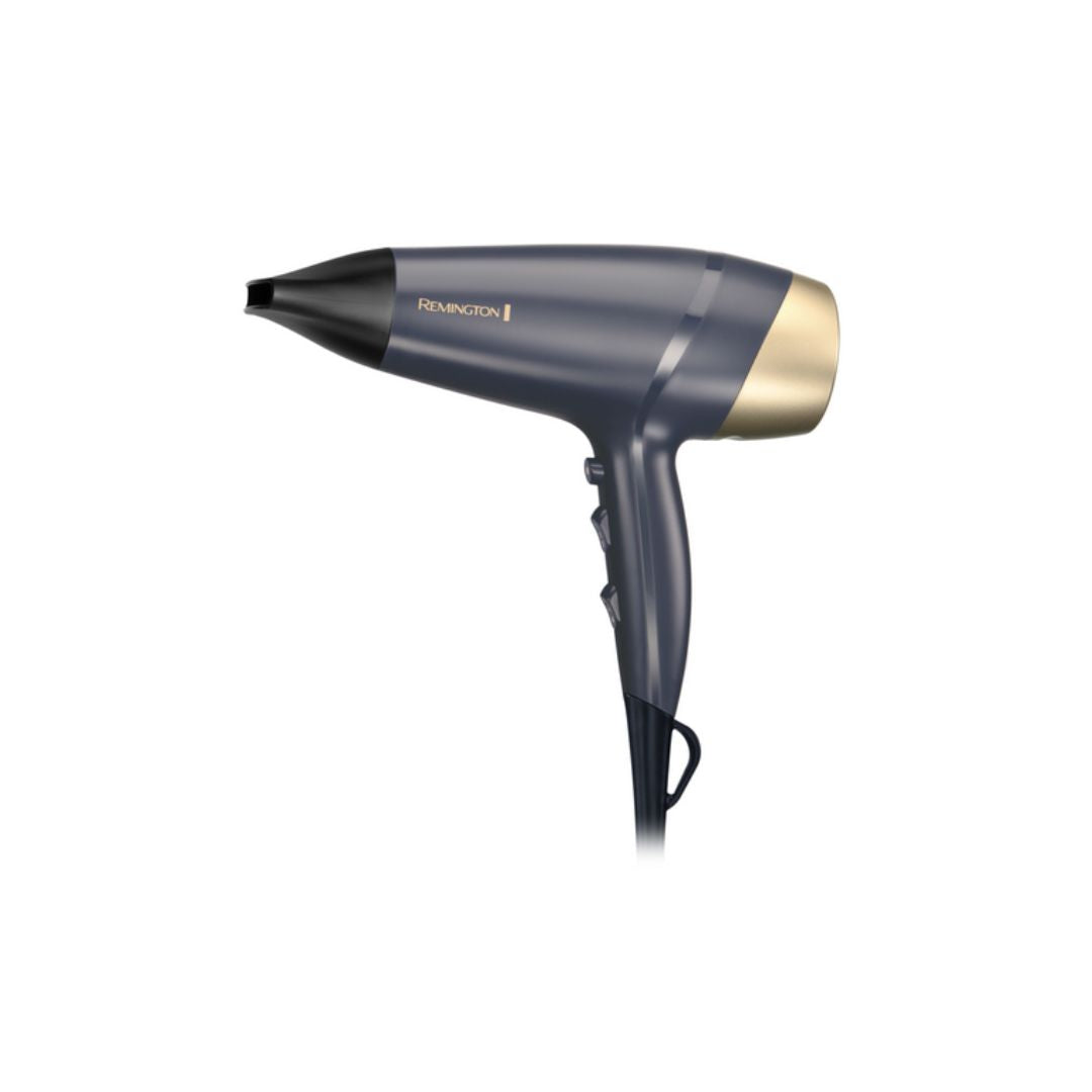 A Remington hair dryer in a dark slate blue-gray color with a metallic gold nozzle and gold brand lettering, shown against a plain white background.