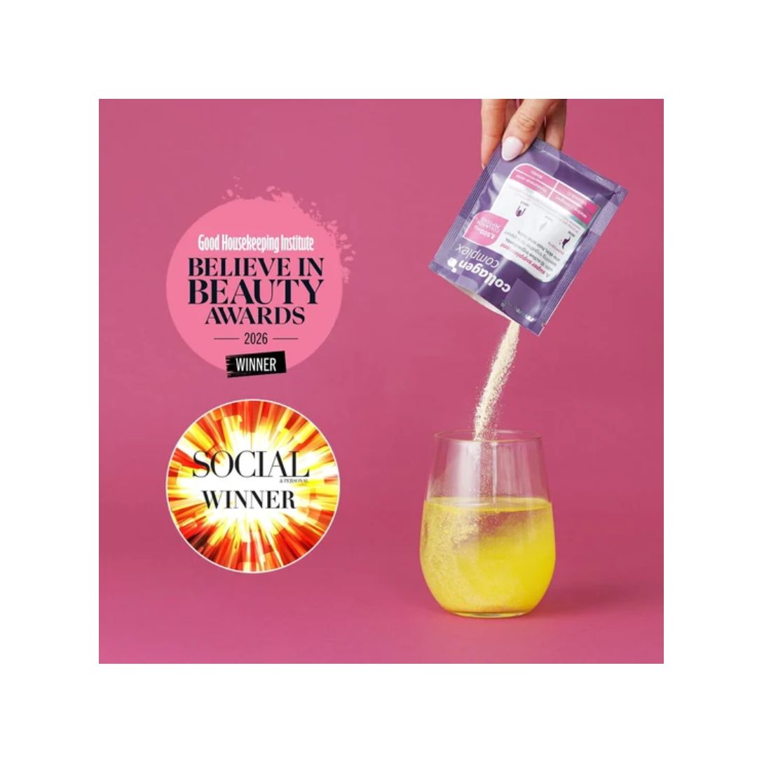 Revive Active Collagen Complex being poured into glass of water on a pink background
