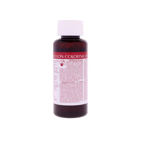 A bottle of Revlon ColorSilk hair color developer, featuring a dark amber brown bottle, a white cap, and a white label with red and black text.