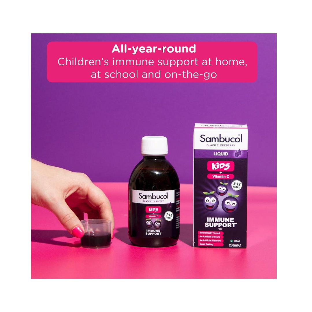 Sambucol Kids Immune Support 230ml bottle, container and measuring cup on a pink background
