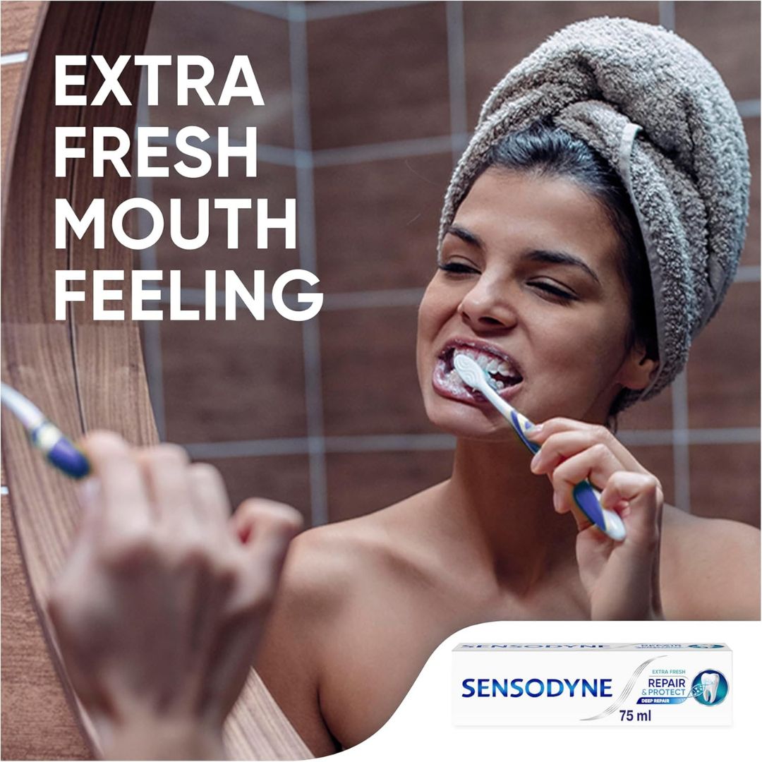 Woman brushing her teeth with a towel on her head, Sensodyne advertisement.