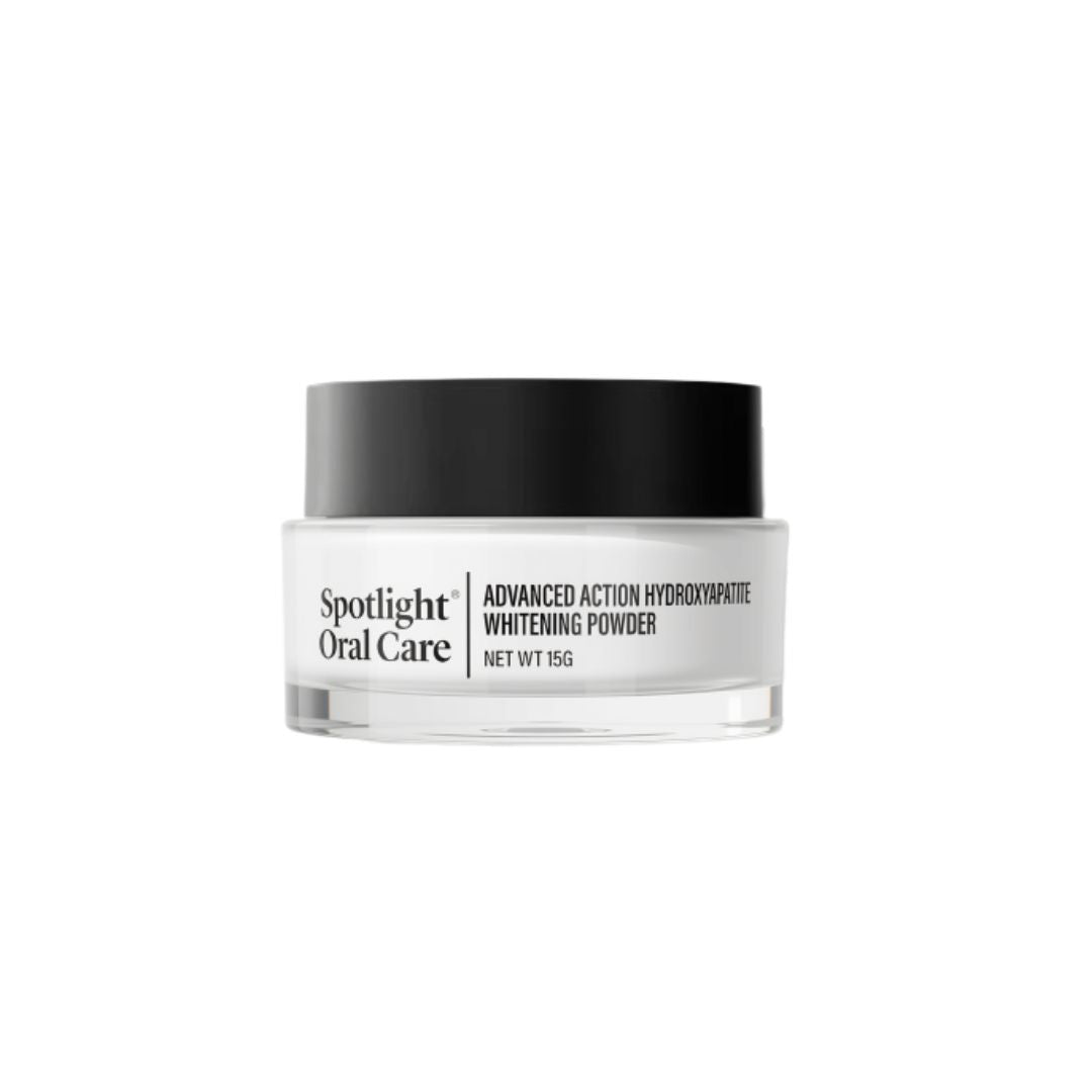 Spotlight Oral Care Advanced Action Hydroxyapatite Whitening Powder in a 15g clear jar with a black lid, shown on a plain white background.