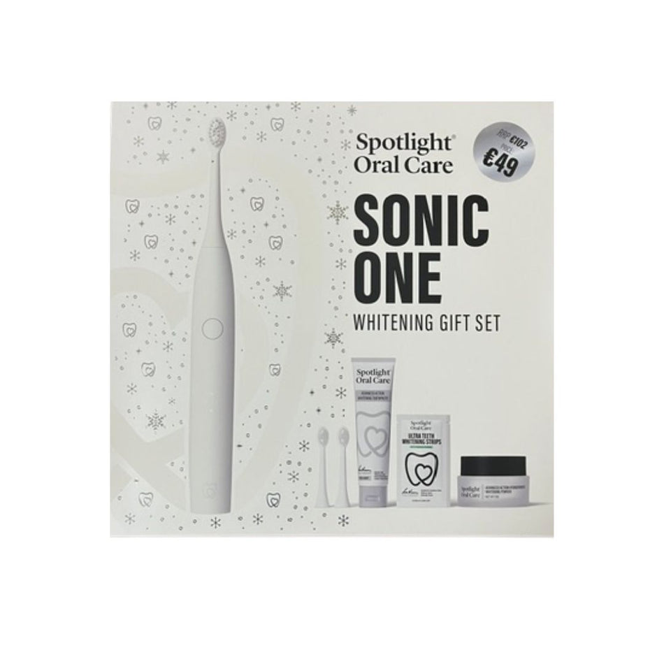 Spotlight Oral Care Sonic One Whitening Gift Set in its retail packaging, featuring a white electric toothbrush, toothpaste, floss, and a whitening cream jar.