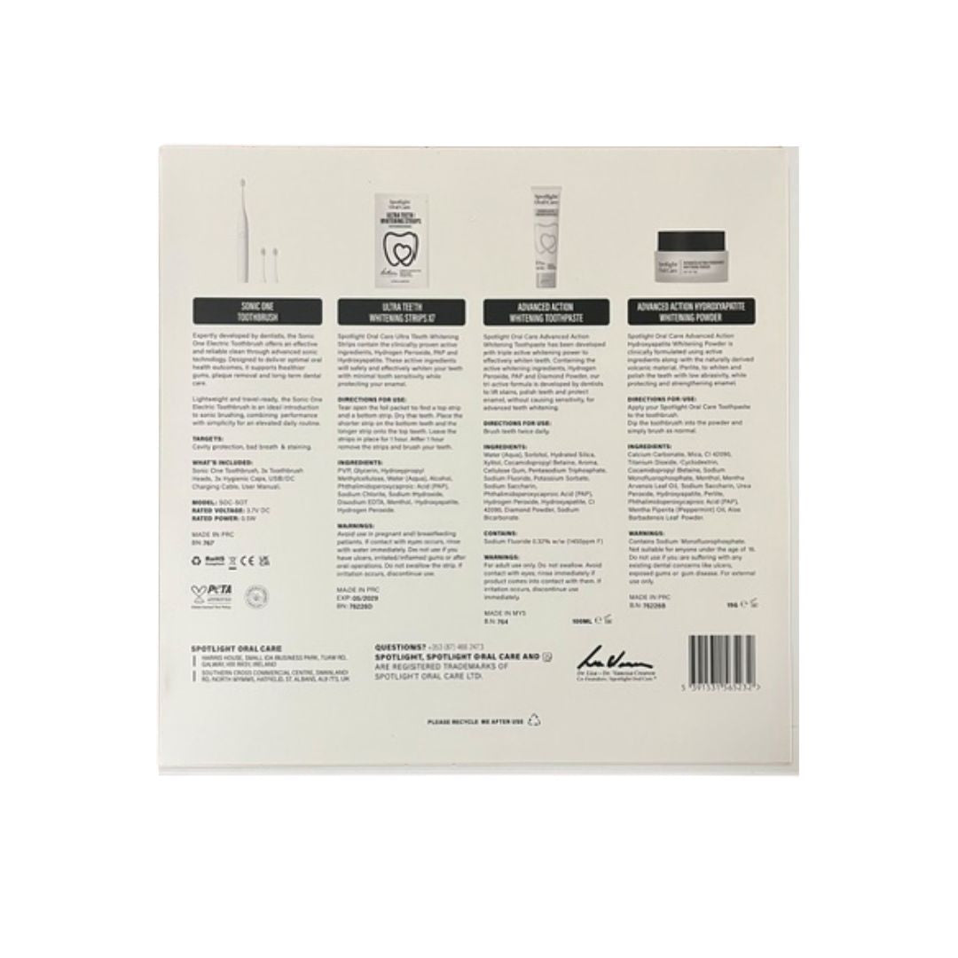 The back of a white cosmetic box showing product information, ingredient icons, regulatory text, a barcode, and a small signature-style logo, photographed on a white background.