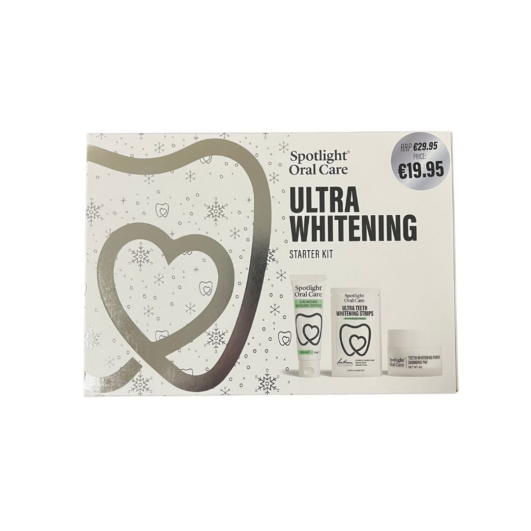 Spotlight Oral Care Ultra Whitening Starter Kit in its retail box, featuring a white and silver design with a large heart outline and product contents pictured on the front.