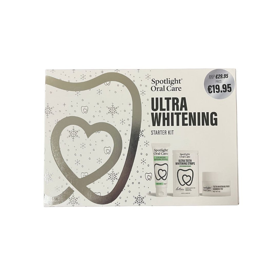Spotlight Oral Care Ultra Whitening Starter Kit in its retail box, featuring a white and silver design with a large heart outline and product contents pictured on the front.