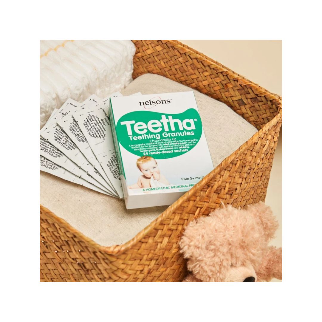 Nelsons Teetha Teething Granules packaging and sachets in a baby basket