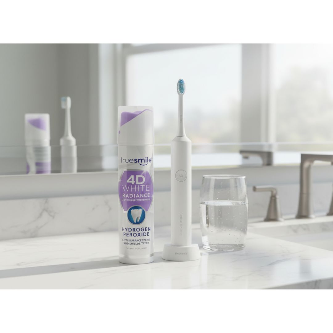 TrueSmile 4D White Radiance Hydrogen Peroxide Toothpaste container in a marble bathrrom setting in front of a mirror