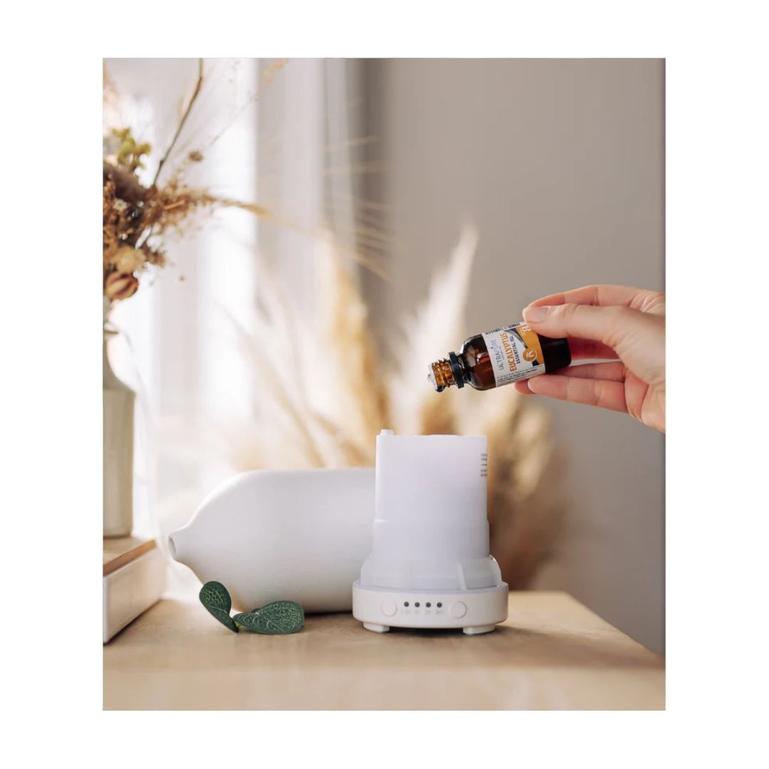 Ultrapure Eucalyptus Essential Oil 25ml being poured into a diffuser