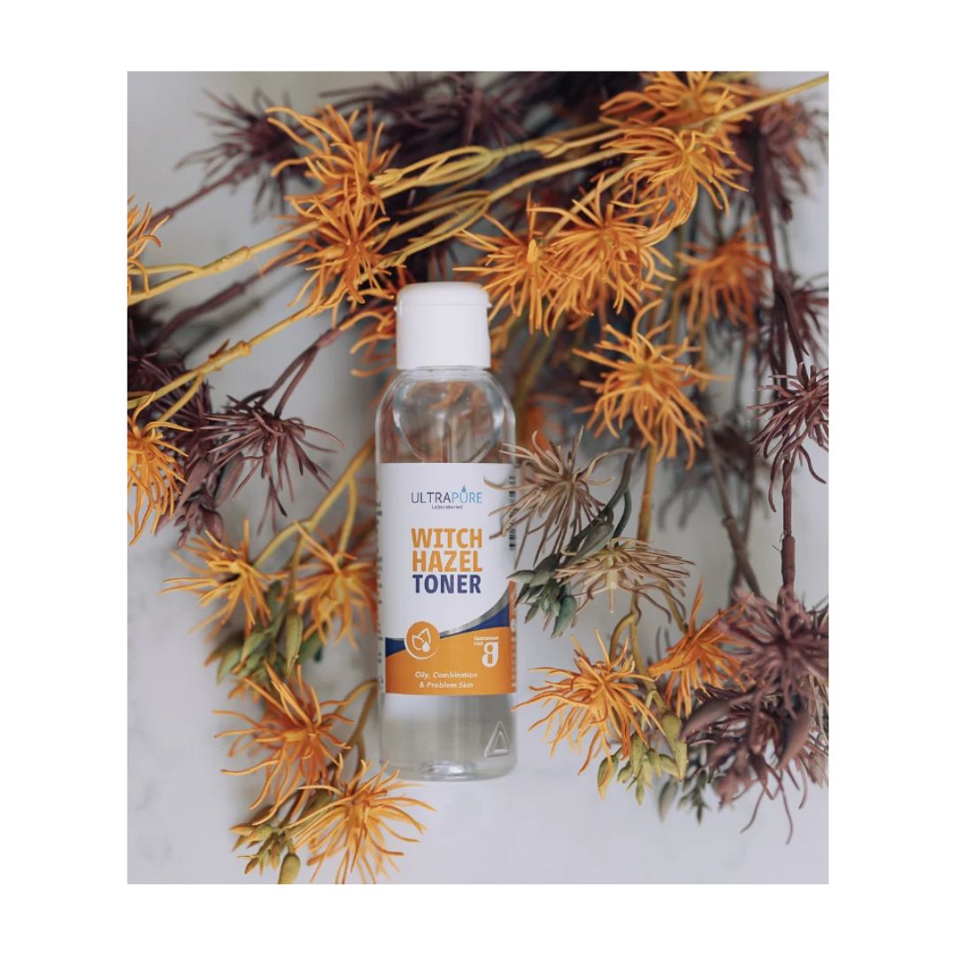 Ultrapure Witch Hazel Toner 125ml container surrounded by shrubbery