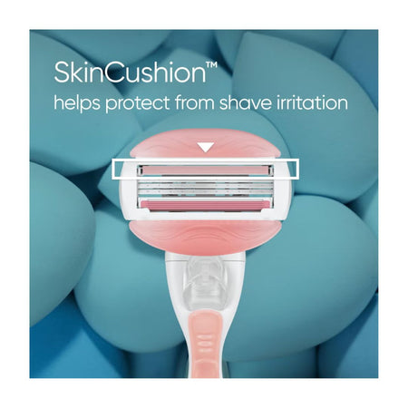 Gillette Venus ComfortGlide Spa Breeze Razor on a blue background with the caption 'SkinCushion'